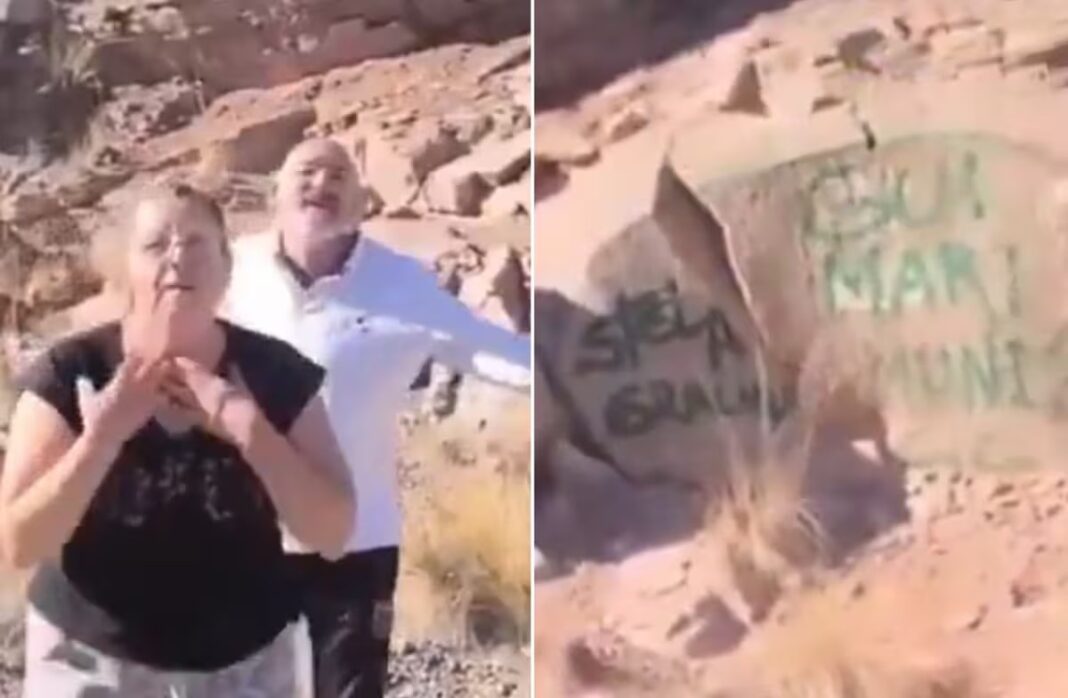 Turistas captados tras pintar rocas en el Dique Potrerillos, Mendoza.